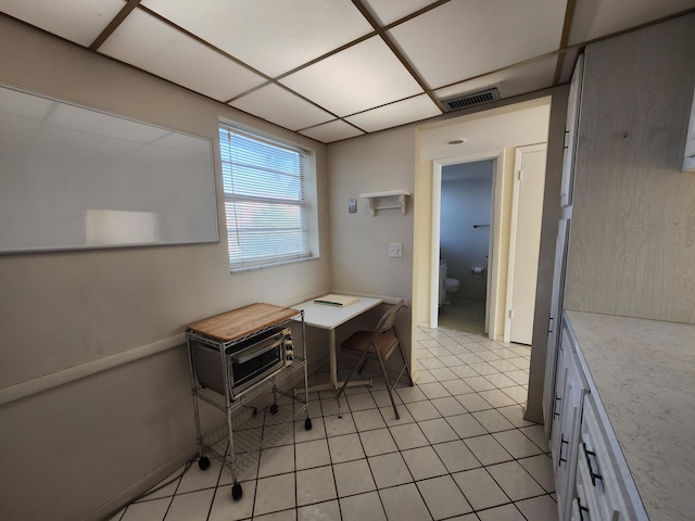 office area with light tile patterned floors