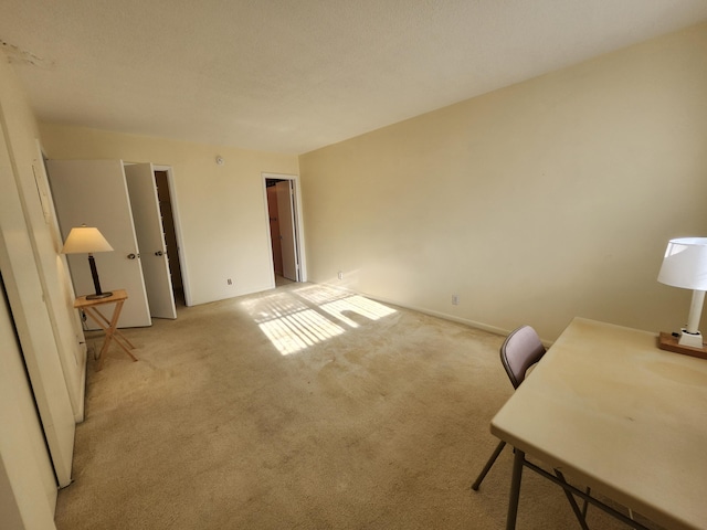 home office with light carpet and baseboards