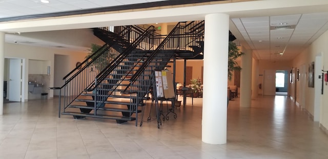 stairs with tile patterned floors