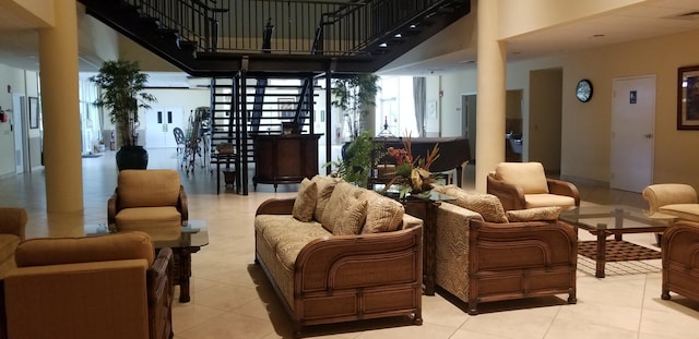 lobby with stairway and a towering ceiling