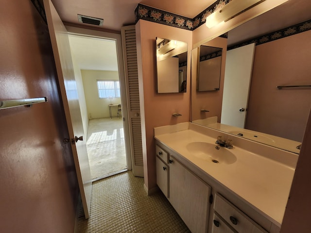 bathroom with vanity and tile patterned floors