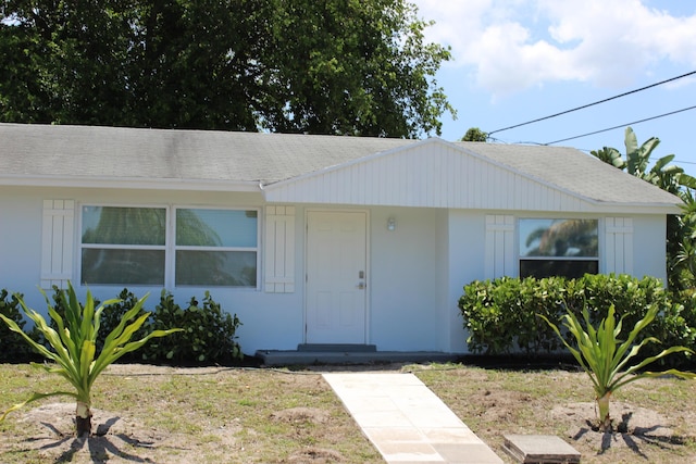 12015 Colony Ave, Palm Beach Gardens, FL 33410 - bungalow-style house with a shingled roof