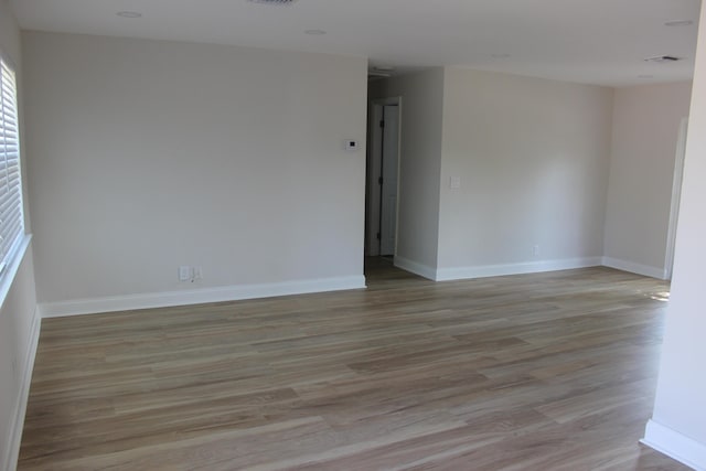 12015 Colony Ave, Palm Beach Gardens, FL 33410 - empty room featuring light wood-type flooring and baseboards