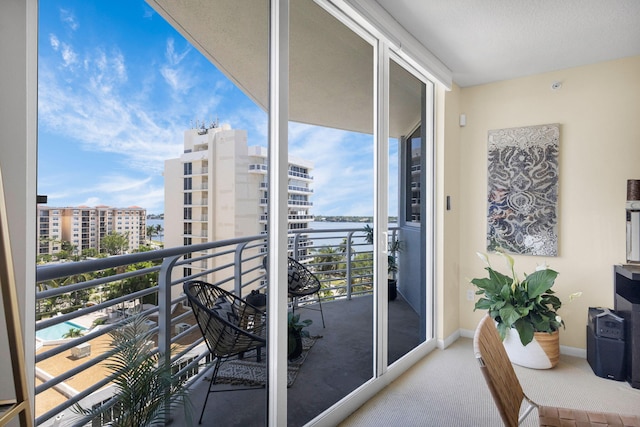 1551 N Flagler Dr Unit 804, West Palm Beach, FL 33401 - balcony featuring a city view and a water view