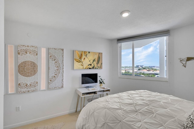 1551 N Flagler Dr Unit 804, West Palm Beach, FL 33401 - carpeted bedroom featuring baseboards and a textured ceiling