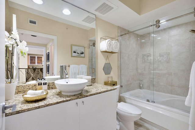 1551 N Flagler Dr Unit 804, West Palm Beach, FL 33401 - full bath featuring vanity, combined bath / shower with glass door, and toilet