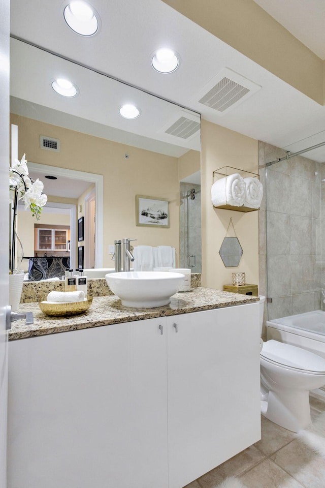 1551 N Flagler Dr Unit 804, West Palm Beach, FL 33401 - ensuite bathroom featuring toilet, vanity, tile patterned floors, recessed lighting, and bathtub / shower combination