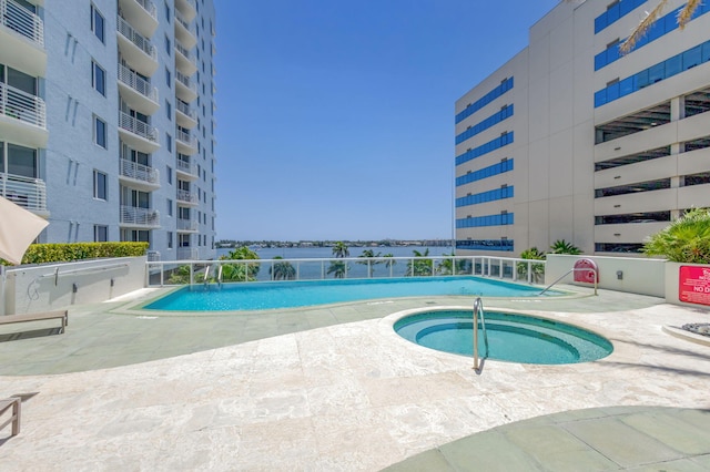 1551 N Flagler Dr Unit 804, West Palm Beach, FL 33401 - community pool with a community hot tub and a patio