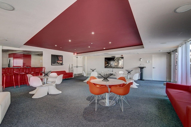 1551 N Flagler Dr Unit 804, West Palm Beach, FL 33401 - dining area featuring carpet, a bar, and baseboards