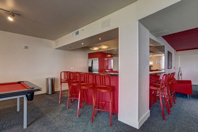 1551 N Flagler Dr Unit 804, West Palm Beach, FL 33401 - carpeted dining room featuring a dry bar, pool table, and baseboards