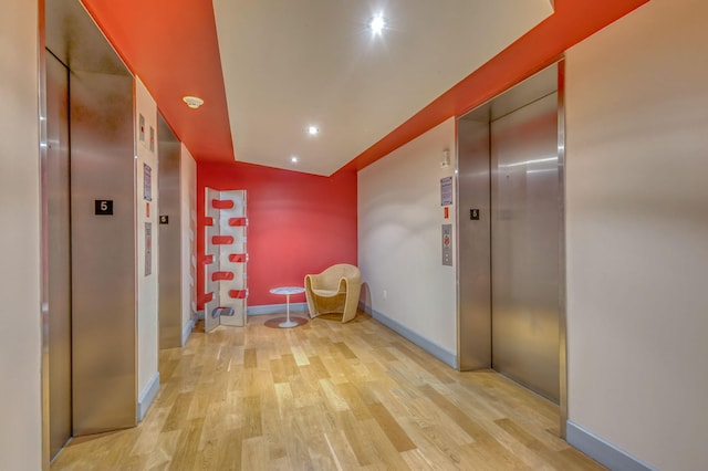 1551 N Flagler Dr Unit 804, West Palm Beach, FL 33401 - corridor featuring elevator, wood finished floors, baseboards, and recessed lighting