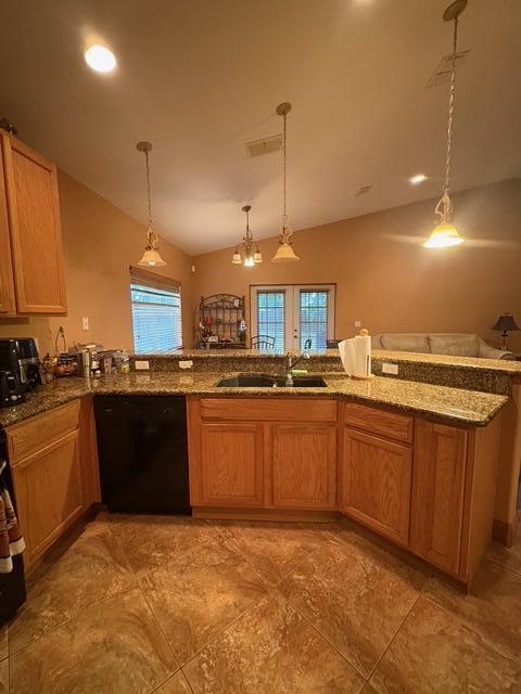 1895 Snapper Dr, Poinciana, FL 34759 - kitchen with dishwasher, lofted ceiling, stone counters, decorative light fixtures, and a sink