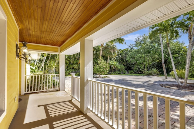 3020 SE St Lucie Blvd, Stuart, FL 34997 - balcony featuring a porch and view of scattered trees