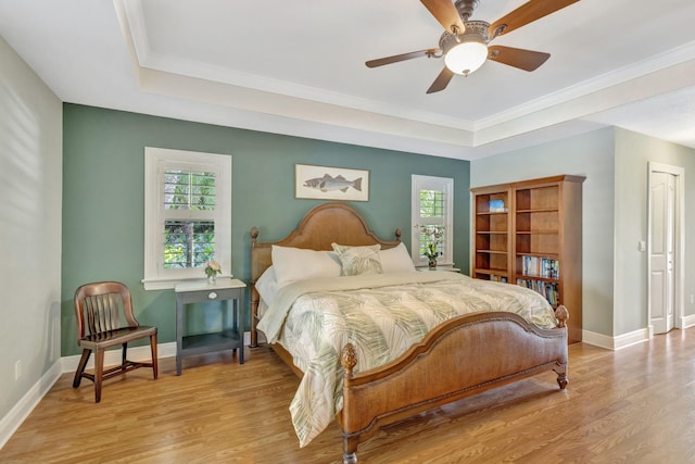 3020 SE St Lucie Blvd, Stuart, FL 34997 - bedroom with multiple windows, wood finished floors, baseboards, and crown molding