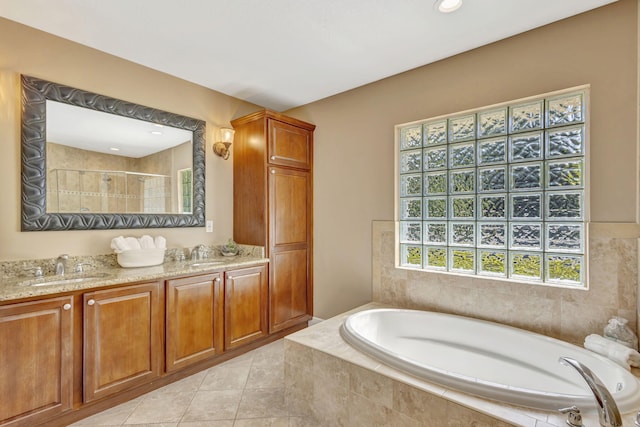 3020 SE St Lucie Blvd, Stuart, FL 34997 - full bathroom with a bath, double vanity, a tile shower, and tile patterned flooring