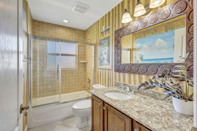 3020 SE St Lucie Blvd, Stuart, FL 34997 - full bath with tile patterned flooring, toilet, combined bath / shower with glass door, and vanity