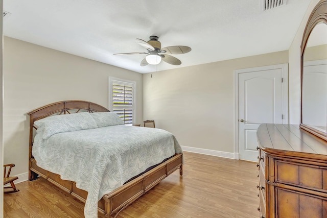 3020 SE St Lucie Blvd, Stuart, FL 34997 - bedroom featuring baseboards, light wood-type flooring, and a ceiling fan