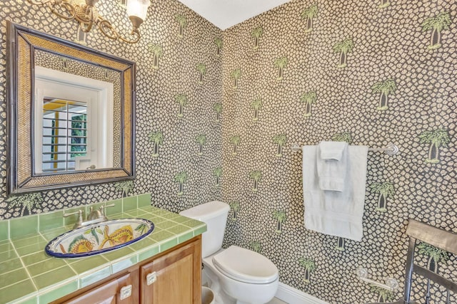 3020 SE St Lucie Blvd, Stuart, FL 34997 - bathroom with toilet, vanity, and a chandelier