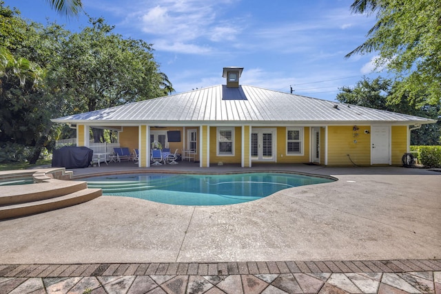 3020 SE St Lucie Blvd, Stuart, FL 34997 - view of swimming pool featuring a patio, french doors, and a pool with connected hot tub