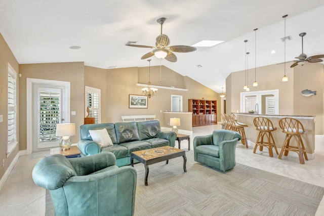 3020 SE St Lucie Blvd, Stuart, FL 34997 - living room featuring ceiling fan, light tile patterned floors, a chandelier, baseboards, and high vaulted ceiling
