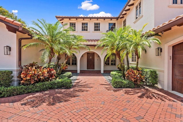 12891 Inshore Dr, Palm Beach Gardens, FL 33410 - mediterranean / spanish-style house featuring stucco siding and a tile roof