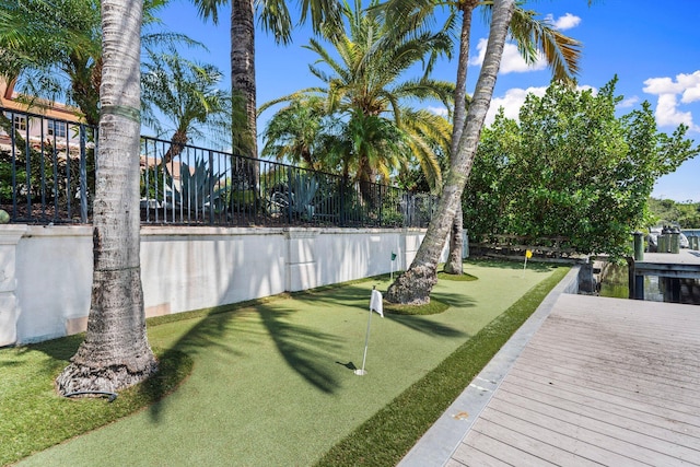12891 Inshore Dr, Palm Beach Gardens, FL 33410 - fenced backyard with a putting green