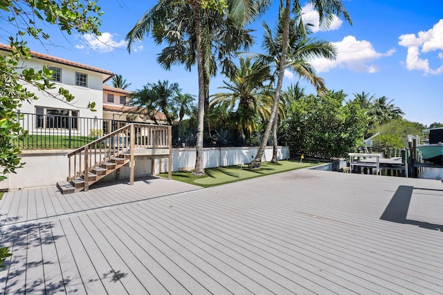 12891 Inshore Dr, Palm Beach Gardens, FL 33410 - deck featuring stairs, a dock, and boat lift