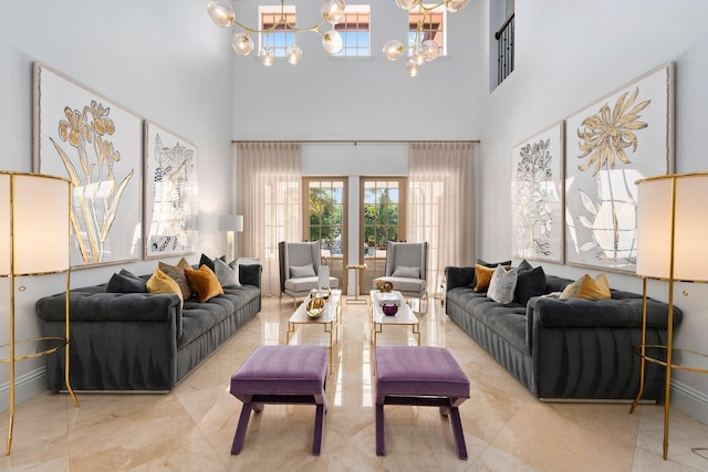 12891 Inshore Dr, Palm Beach Gardens, FL 33410 - living area with a chandelier, a towering ceiling, marble finish floors, and french doors