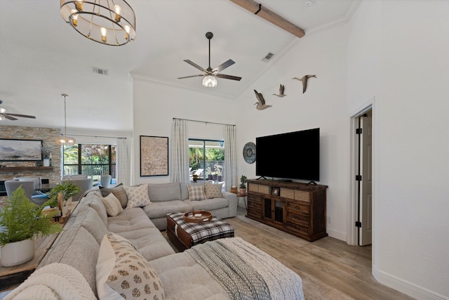 17315 Orange Blvd, Loxahatchee, FL 33470 - living room with a ceiling fan, a chandelier, plenty of natural light, baseboards, and high vaulted ceiling
