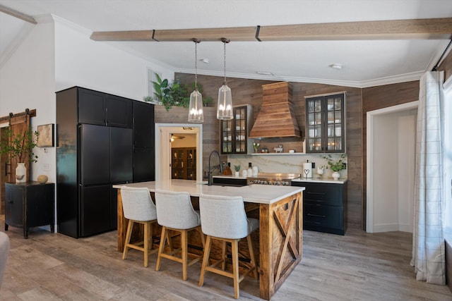 17315 Orange Blvd, Loxahatchee, FL 33470 - kitchen featuring custom range hood, a sink, high quality fridge, light countertops, and light wood-style floors