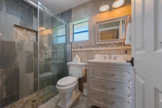 17315 Orange Blvd, Loxahatchee, FL 33470 - full bathroom featuring toilet, a shower stall, vanity, and tile walls