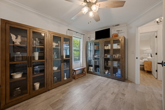 17315 Orange Blvd, Loxahatchee, FL 33470 - dining room featuring crown molding, ceiling fan, and light wood finished floors