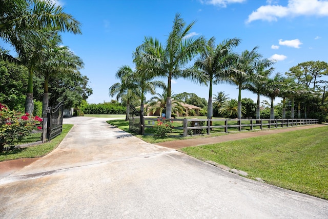 17315 Orange Blvd, Loxahatchee, FL 33470 - view of concrete driveway with a gated entry