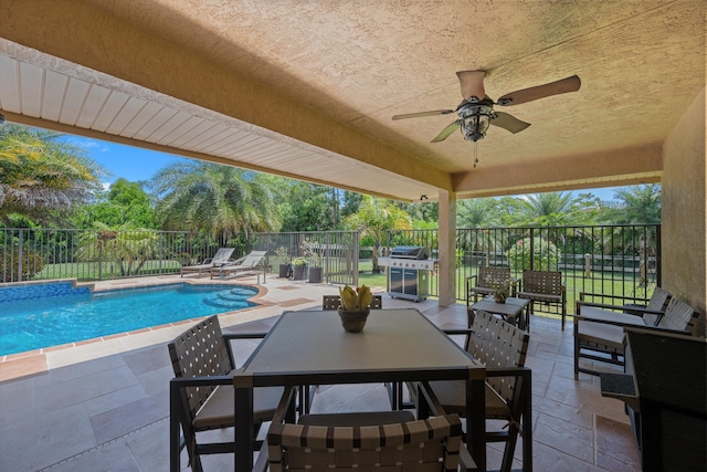 17315 Orange Blvd, Loxahatchee, FL 33470 - view of patio / terrace with a fenced backyard, a ceiling fan, outdoor dining area, and grilling area