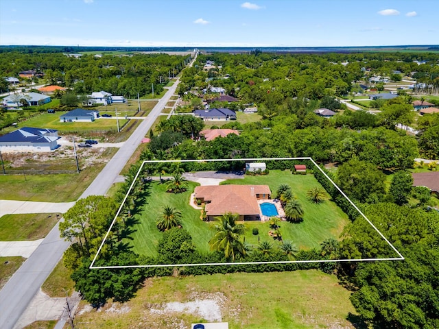17315 Orange Blvd, Loxahatchee, FL 33470 - aerial view of residential area featuring property boundaries highlighted, a tree filled landscape, and a pool