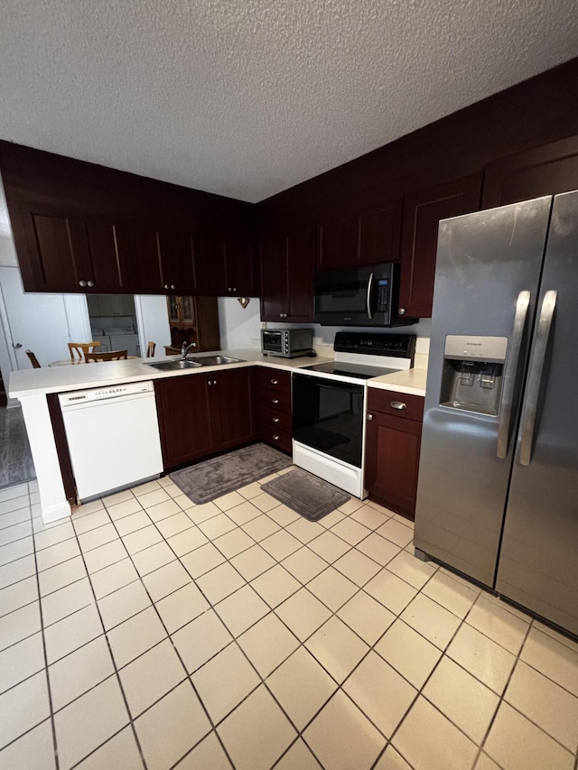 kitchen featuring stainless steel fridge with ice dispenser, electric stove, white dishwasher, a sink, and a textured ceiling