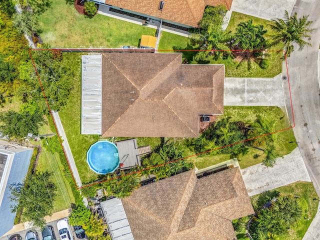 aerial view of property and surrounding area featuring property parcel outlined
