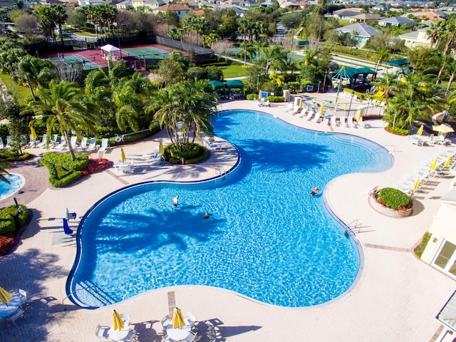 community pool with a patio area