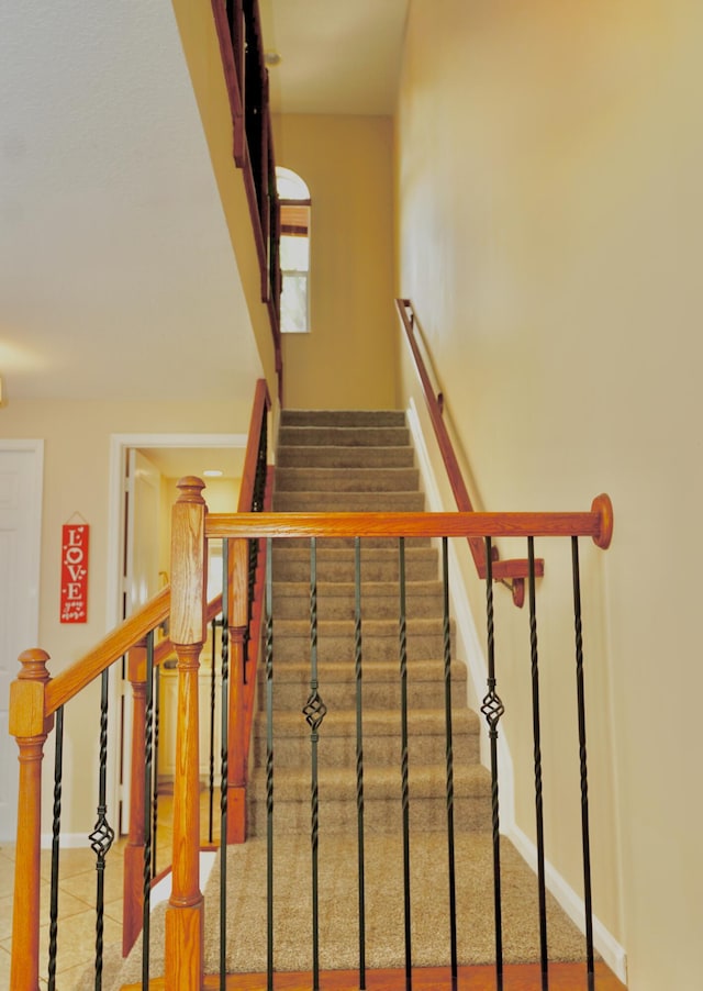 11296 SW Barton Way, Port Saint Lucie, FL 34987 - stairs featuring baseboards and tile patterned floors