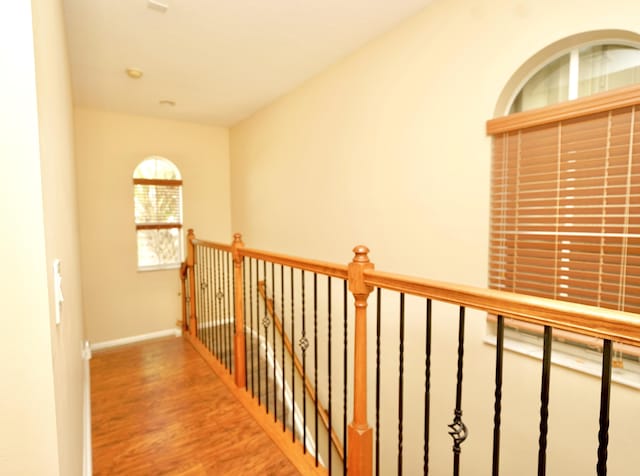 11296 SW Barton Way, Port Saint Lucie, FL 34987 - hall with wood finished floors and an upstairs landing