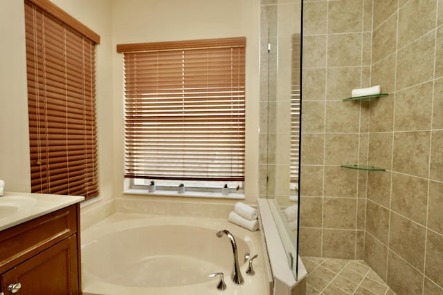 11296 SW Barton Way, Port Saint Lucie, FL 34987 - bathroom featuring a garden tub, vanity, and a tile shower