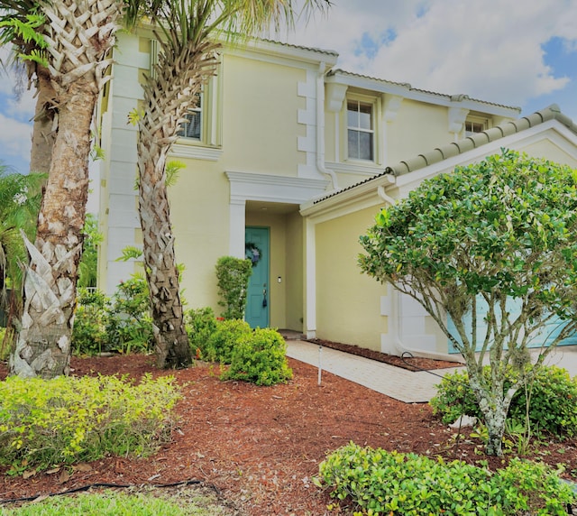 11296 SW Barton Way, Port Saint Lucie, FL 34987 - view of front facade with a tile roof and stucco siding