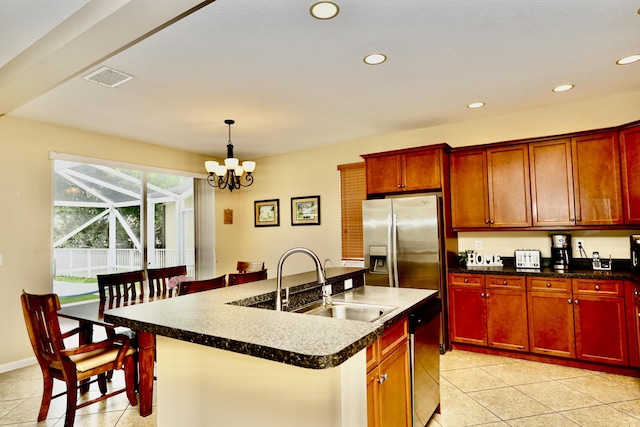 11296 SW Barton Way, Port Saint Lucie, FL 34987 - kitchen featuring stainless steel appliances, light tile patterned floors, a kitchen island with sink, recessed lighting, and hanging light fixtures