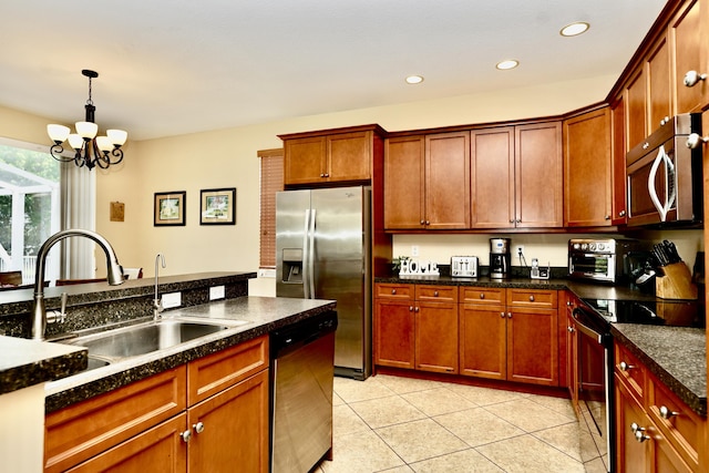 11296 SW Barton Way, Port Saint Lucie, FL 34987 - kitchen with appliances with stainless steel finishes, light tile patterned flooring, a chandelier, recessed lighting, and hanging light fixtures