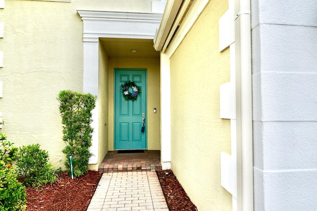 11296 SW Barton Way, Port Saint Lucie, FL 34987 - view of exterior entry with stucco siding