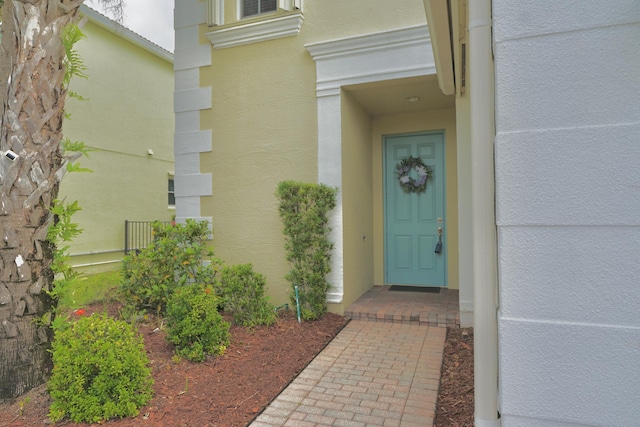 11296 SW Barton Way, Port Saint Lucie, FL 34987 - view of exterior entry with stucco siding