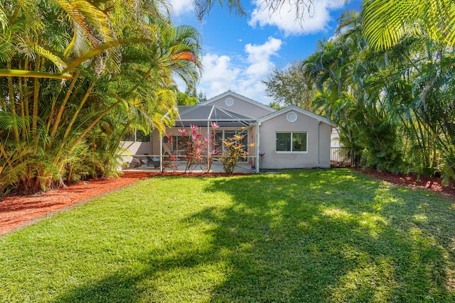 7884 Travlers Tree Dr, Boca Raton, FL 33433 - back of house with stucco siding, a patio, and glass enclosure