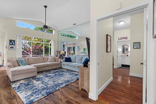 7884 Travlers Tree Dr, Boca Raton, FL 33433 - living area with wood finished floors, lofted ceiling, a ceiling fan, baseboards, and a textured ceiling