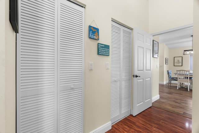 7884 Travlers Tree Dr, Boca Raton, FL 33433 - hall with dark wood-type flooring and baseboards