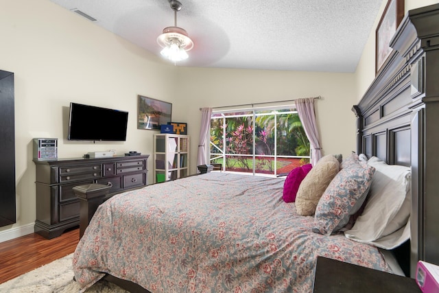 7884 Travlers Tree Dr, Boca Raton, FL 33433 - bedroom with lofted ceiling, wood finished floors, a textured ceiling, baseboards, and a ceiling fan